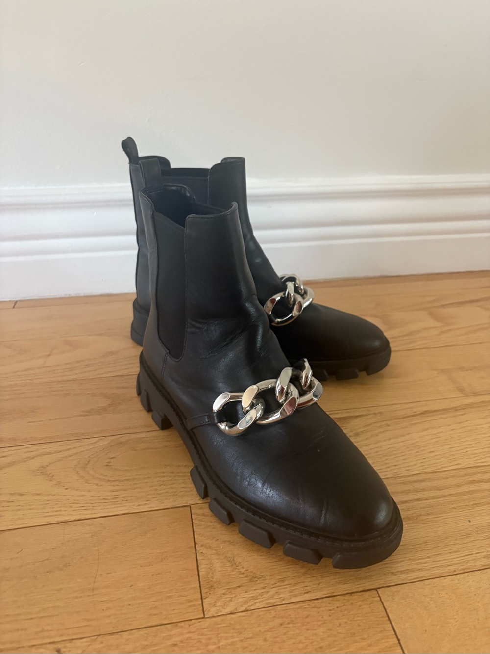 Michael Kors Black Leather Lug-Sole Chelsea Boots with Silver Chain